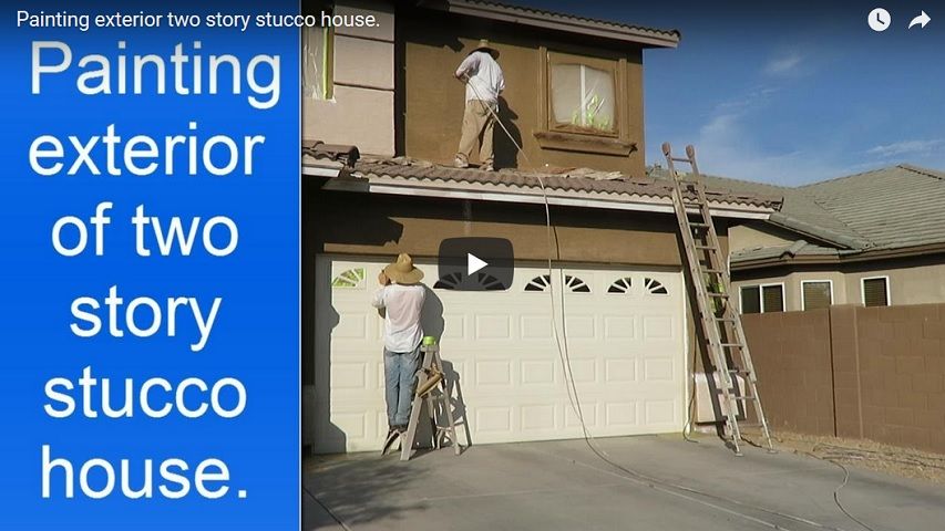 Painting exterior two story stucco house